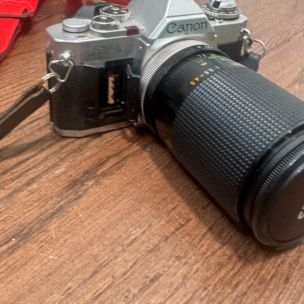 Canon AV 1 35mm SLR Film Camera Silver Sakar 35 135mm Lens Strap Untested